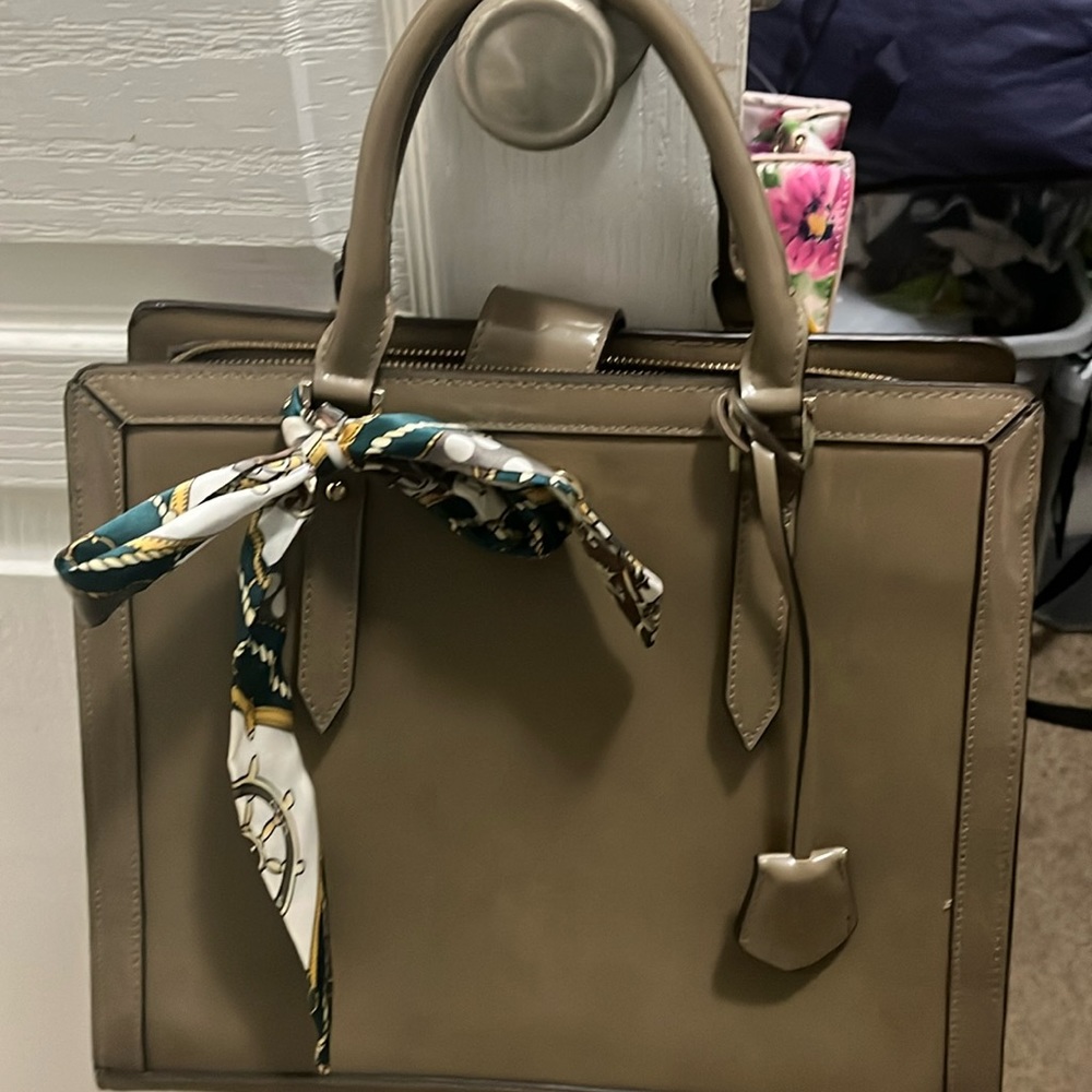 The limited Handbag comes with a clutch